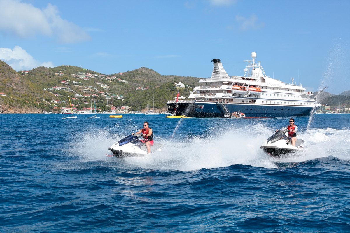 Guests on jet skis beside SeaDream II